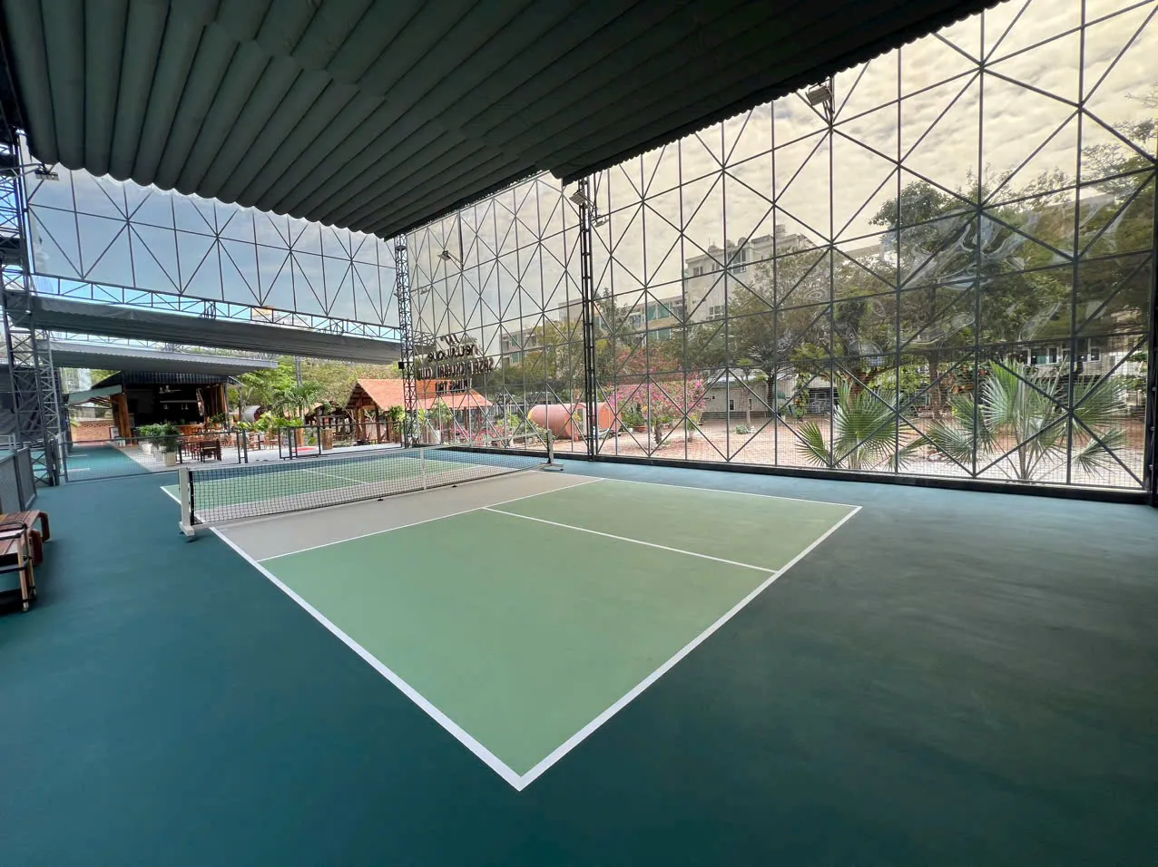 Pickleball courts under a space-frame roof